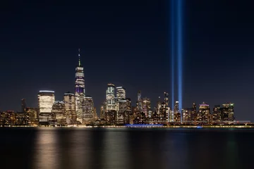 Jersey City, NJ - USA - Aug 30 2019: The 9/11 Tribute in Lights temporary monument in lower Manhattan New York City view from New Jersey © Studio 30fps