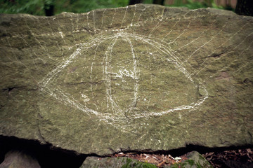 chalk drawing on stone. painted eye on stone
