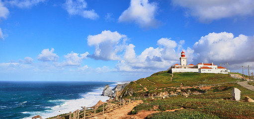 Fototapeta na wymiar Cabo da Roca, Portugal. Lighthouse and cliffs over Atlantic Ocean, the most westerly point of the European mainland.