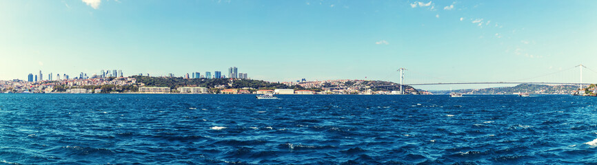 Fototapeta na wymiar Istanbul sea panorama, business district and Ortakoy Mosque on the background