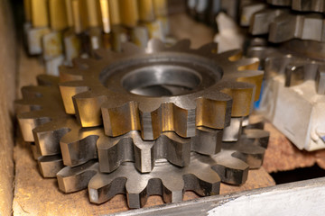 Gear cutting tool in a warehouse in a workshop, a worm cutter for gear processing on a gear cutting machine.
