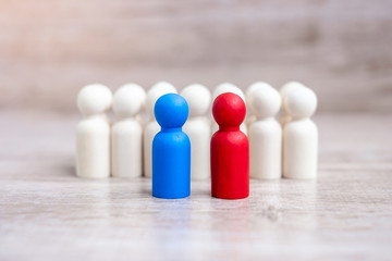 Red and blue businessmen with crowd of wooden men. Candidate, leadership, business, team, teamwork and Human resource management concept