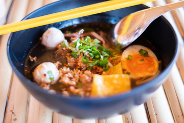 Thai style pork chops noodle and boiled egg in 