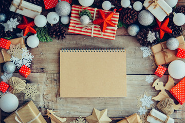 Christmas background with letter and gift boxes on the wooden ta