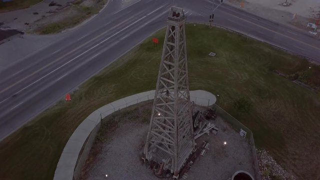 Aerial tilt down on large oil derrick in Casper Wyoming