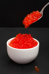 Red caviar in a saucer
