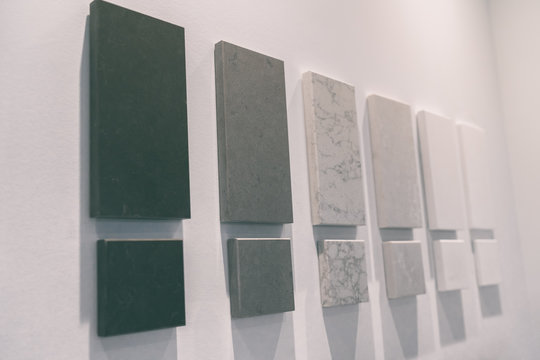 Kitchen countertop quartz samples at home improvement interior design store or condo project showroom office. House remodeling renovation colors of solid surfaces countertops stones.