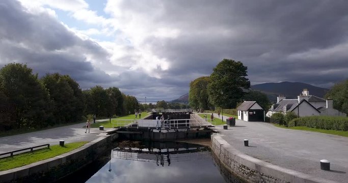 aerial footage of neptune's staircase leading to the caledonian canal in fort william and banavie in the argyll and lochaber region of the highlands of scotland in autumn