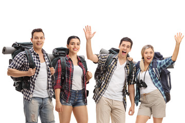 Young male and female hikers with backpacks