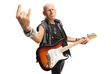 Male rock star with a guitar gesturing rock and roll sign