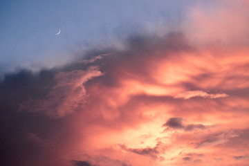 clouds and moon at sunset