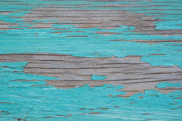 Textured wood with old turquoise paint
