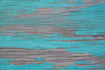 Textured wood with old turquoise paint
