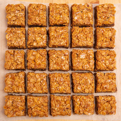square brownies with caramel and flakes