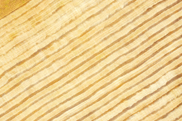 Combine harvester harvests wheat in the field at sunset in autumn in Russia. top view of the field after harvesting.