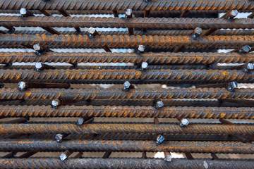 Industrial background. Rebar texture. Rusty rebar for concrete pouring. Steel reinforcement bars. Construction rebar steel work reinforcement. Closeup of Steel rebars.