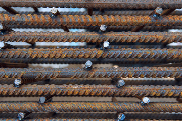 Industrial background. Rebar texture. Rusty rebar for concrete pouring. Steel reinforcement bars. Construction rebar steel work reinforcement. Closeup of Steel rebars.