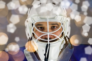 Detail of a male face in a white goalie hockey mask and  round and PENTAGON lights.This is a detail...
