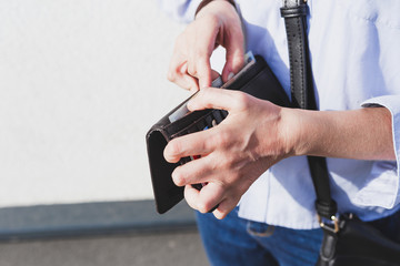 Business woman counting money from her wallet