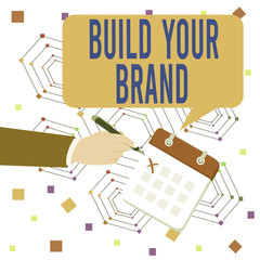Conceptual hand writing showing Build Your Brand. Concept meaning enhancing brand equity using advertising campaigns Formal Suit Crosses Off One Day Calendar Red Ink Ballpoint Pen