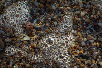 sea pebbles colored granite on the beach