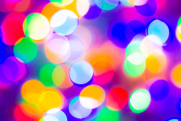Defocused abstract multicolored bokeh lights background. Blue, purple, green, orange colors. - christmas and new year concept