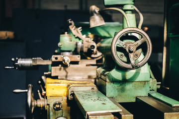 old machine tools at the factory. Metal processing on equipment