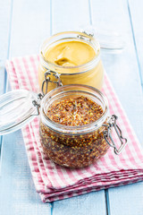 Fototapeta premium Yellow mustard and whole grain mustard.