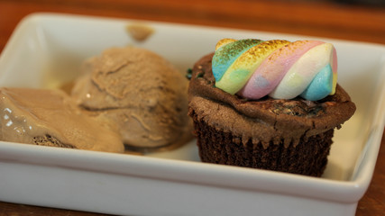 Chocolate cupcake with colorful marshmallow on top