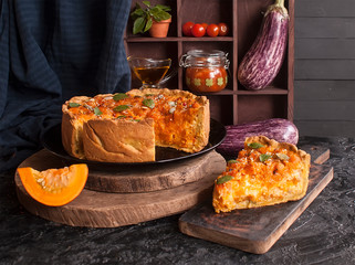 Pumpkin rustic tart on dark background on wooden table. Selective focus.  Thanksgiving day.