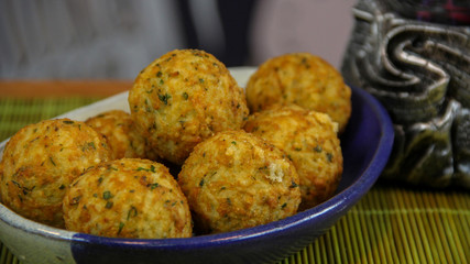 Big crispy cheese balls served in a colorful tray