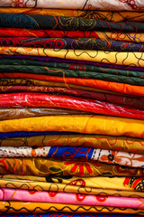 Indian fabrics decorated, colored and stacked