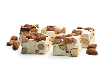 Homemade nougat bar with almonds isolated on white
