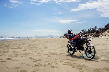 Motorcycle tour of Vietnam. Motorcycle on a wild beach in Vung Tau
