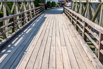 Wooden bridge in picturesque Rastoke village, near Slunj, Croatia on sunny summer day