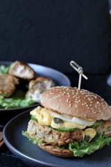 Brain Burger. Fried brains beef, calf or sheep are fried in deep fried as a cutlet in a burger. lettuce, cheese sauce, fresh cucumber and capers. fashionable exotic food. weird food
