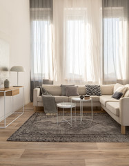 Beige comfortable corner sofa with grey pillows in elegant living room interior with white wall