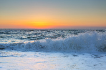Fototapeta na wymiar Sea and waves in the morning nice sunrise colors background