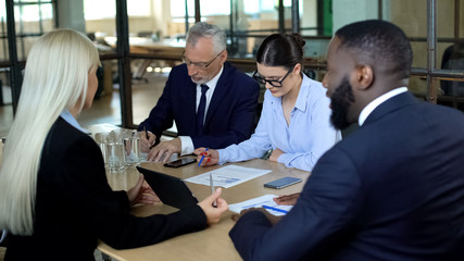 Company managers discussing agreement in meeting room, business negotiation tips