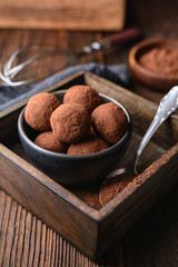 Delicious treat, homemade chocolate truffle covered in cocoa powder