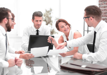 business team discussing financial documents.