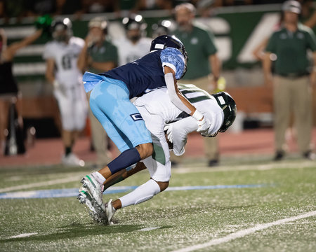 Great action photos of high school football players making amazing plays during a football game