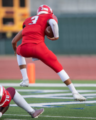 Great action photos of high school football players making amazing plays during a football game