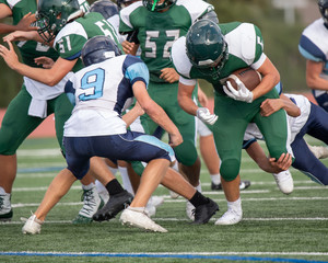 Great action photos of high school football players making amazing plays during a football game