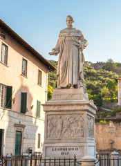 Fototapeta na wymiar Marble statue on a pedestal to Leopoldo II in Pietrasanta, Tuscany, Italy.
