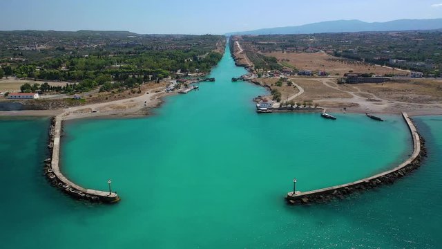 Aerial video taken by drone of Corinth Canal of Isthmos or Isthmus connecting mainland with Peloponnese, Greece