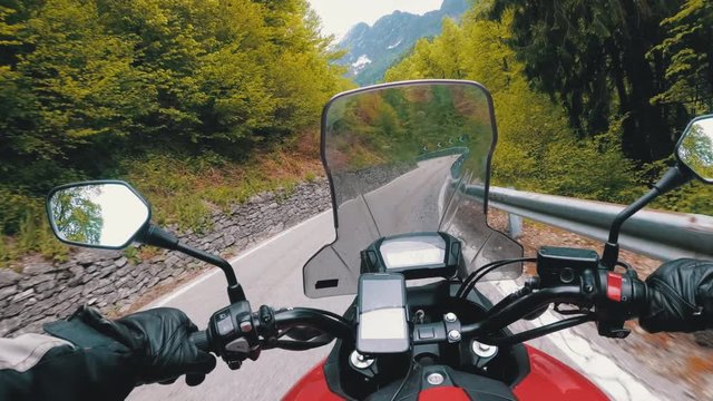 Motorcyclist on Motorbike Rides on a Beautiful Landscape Mountain Road in Italy