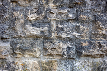 texture of old grey stone wall, closeup and full frame