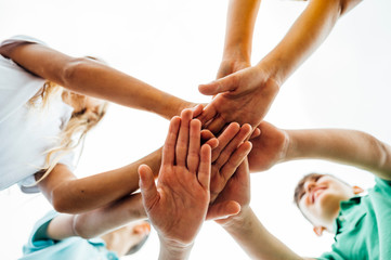 Group of children with their hands together