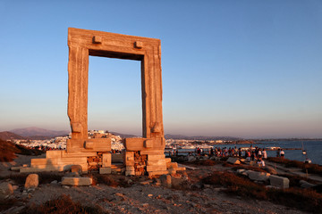 sunset at Naxos Portara, Apollo's 6th Cent BC temple ruins, overlooking Naxos town, Greek Islands	